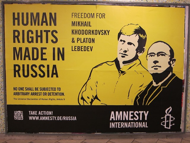 Billboard in train station calling for freedom for Khodorkovsky and Lebedev
