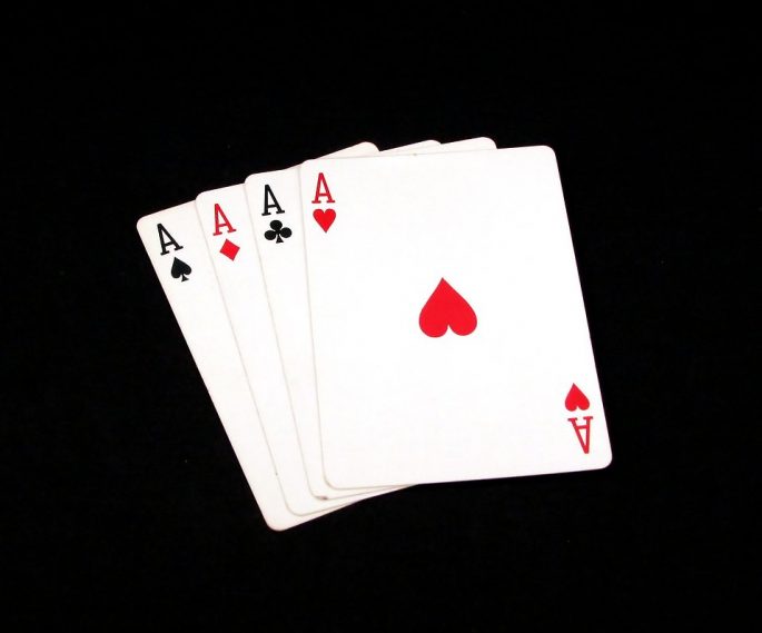 8677-four-aces-isolated-on-a-black-background-pv