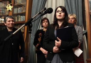 The daughter of fallen Russian oil oligarch Mikhail Khodorkovsky, Anastasia, speaks after receiving a literary prize, won by her father, while the writer Lyudmila Ulitskaya listens, during an awarding ceremony in Moscow