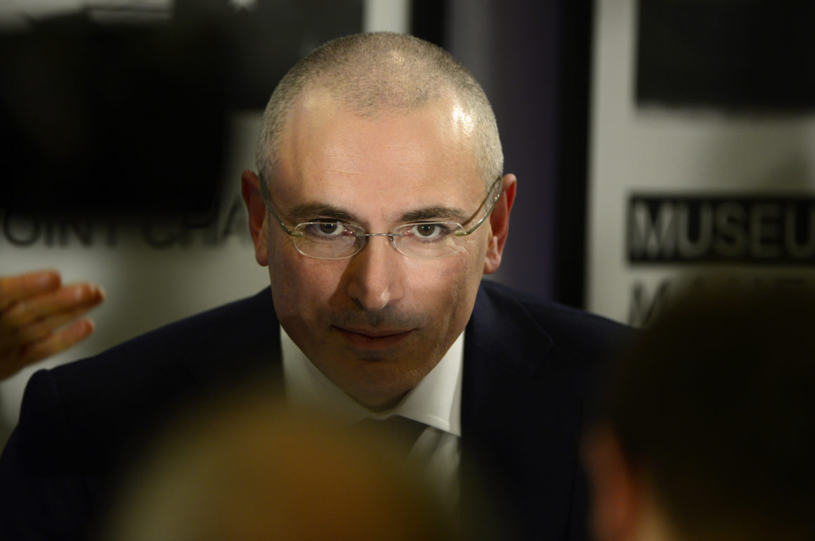 Russian former oil tycoon and Kremlin critic Mikhail Khodorkovsky addresses a press conference at the Wall Museum at Checkpoint Charlie on December 22, 2013 in Berlin. Khodorkovsky has been reunited with his family in Berlin, after being freed from jail following a surprise pardon by Russian President Vladimir Putin. AFP PHOTO / JOHN MACDOUGALL (Photo credit should read JOHN MACDOUGALL/AFP/Getty Images)